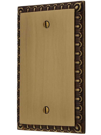 Ovolo Blank Cover Plate in Antique Brass.